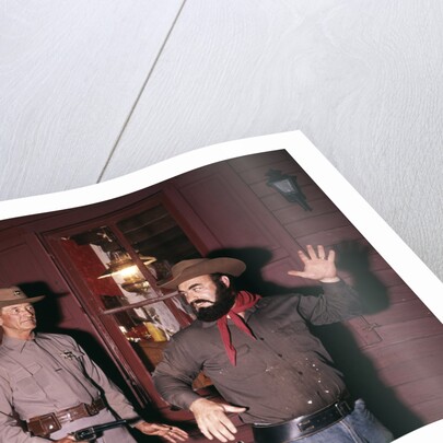 1960s 1970s western sheriff arrests bearded cowboy about to draw gun by Anonymous