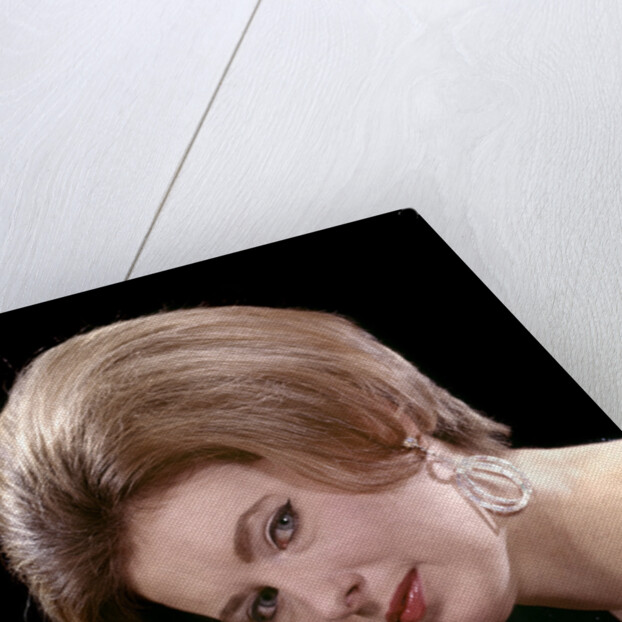 1960s portrait serious woman black sequin evening diamond earrings dress bouffant hairstyle looking at camera by Anonymous