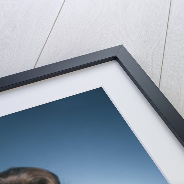 1960s smiling brunette woman in print dress looking up by Anonymous