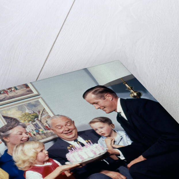 1960s three generation family with birthday cake by Anonymous