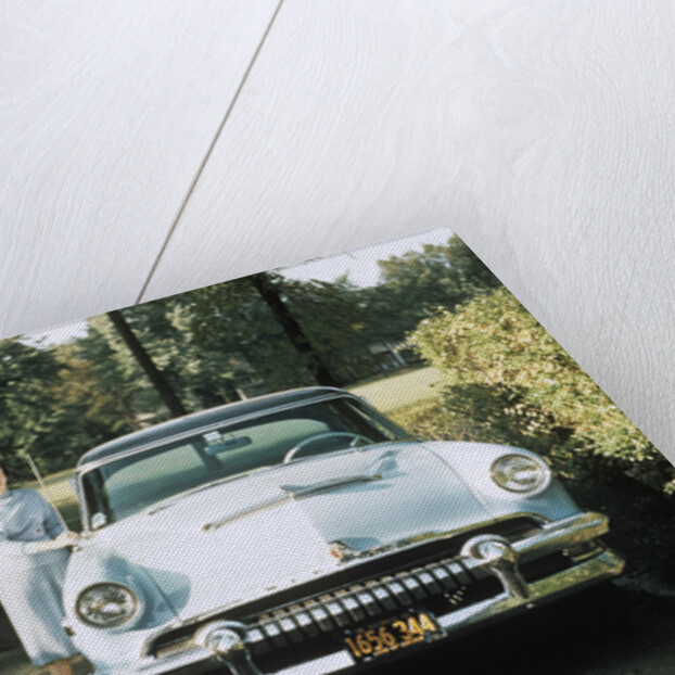 1950s 1955 woman standing beside 1954 mercury automobile by Anonymous