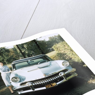 1950s 1955 woman standing beside 1954 mercury automobile by Anonymous