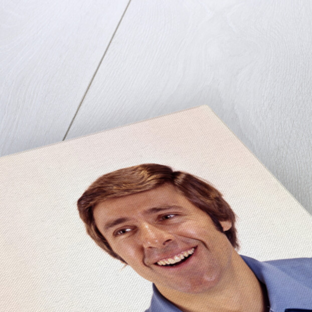 1970s man portrait head shoulders blue shirt laughing toothy smile by Anonymous