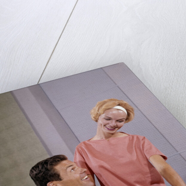 1960s couple husband wife bowling checking the score indoor by Anonymous