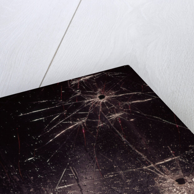 1970s bullet holes and raindrops on shattered glass windshield by Anonymous