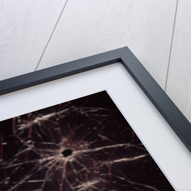 1970s bullet holes and raindrops on shattered glass windshield by Anonymous