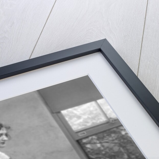 1920s woman packing clothes for travel by Anonymous