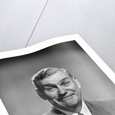 1950s mature middle aged man smiling business suit tie happy amused funny face expression by Anonymous