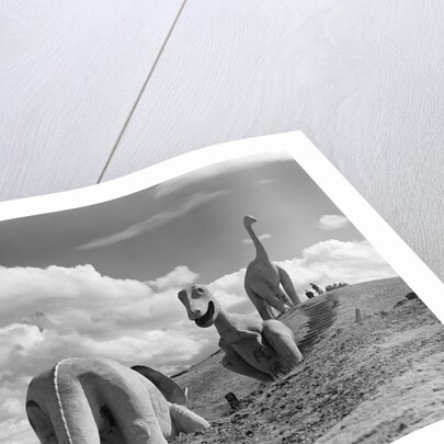 1950s dinosaur park south dakota three dinosaur statues on hillside by Anonymous