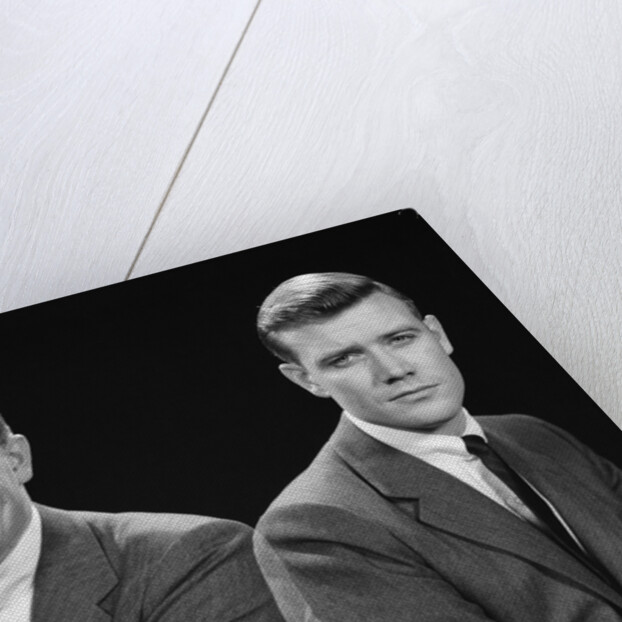 1950s double exposure of man with a smile and a frown wearing a suit by Anonymous