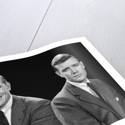 1950s double exposure of man with a smile and a frown wearing a suit by Anonymous