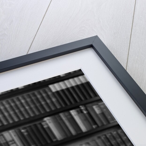 1930s 1940s retired senior couple looking at check in living room man smoking pipe by Anonymous
