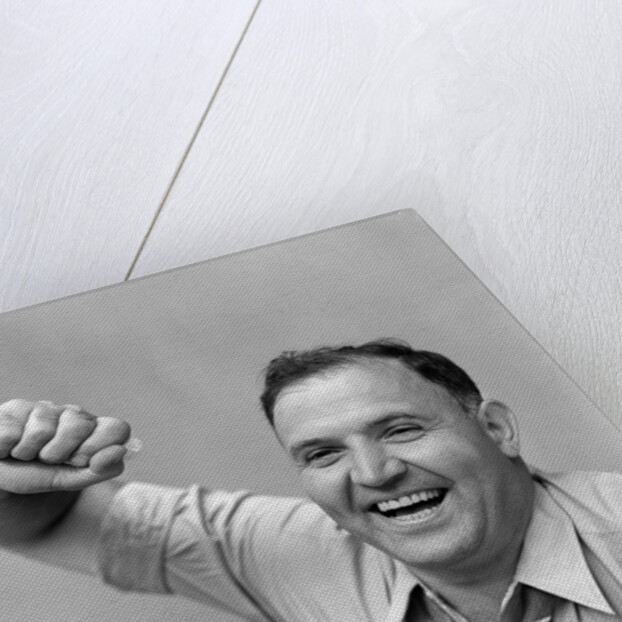 1940s 1950s portrait of man in shirt and tie holding handkerchief smiling by Anonymous