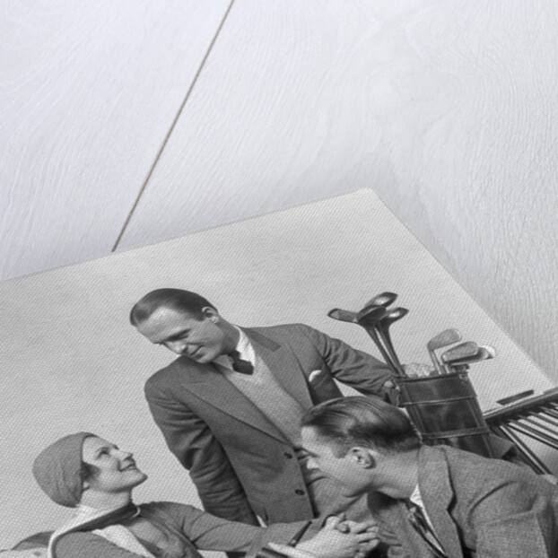 1930s two men one woman golf clubs bag smiling talking sitting bamboo chair man smoking pipe by Anonymous