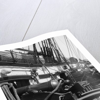 1930s row of cannon breeches on gun deck of sailing naval ship of war by Anonymous