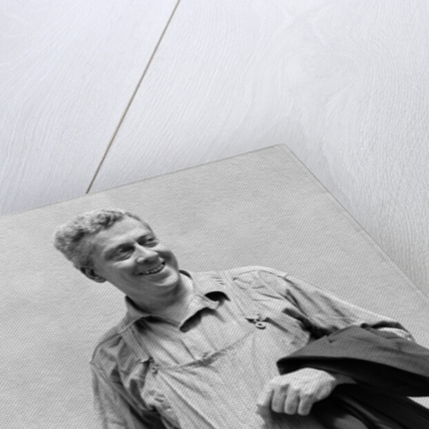 1930s man in overalls work uniform holding thermos lunchbox and jacket by Anonymous