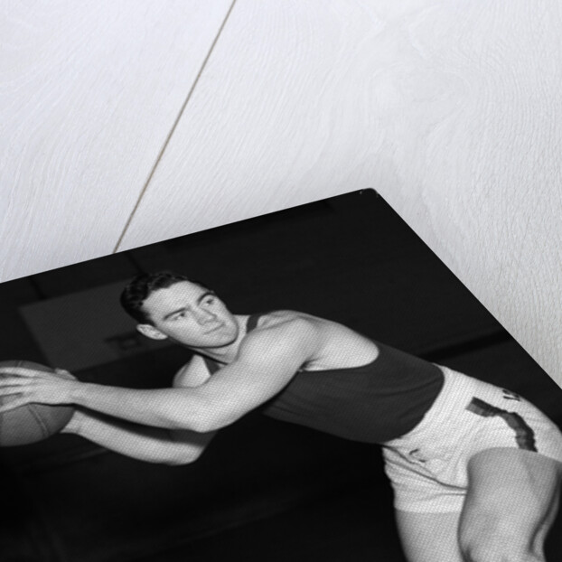1930s teen boy playing basketball holding ball standing in position by Anonymous