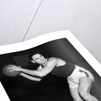 1930s teen boy playing basketball holding ball standing in position by Anonymous