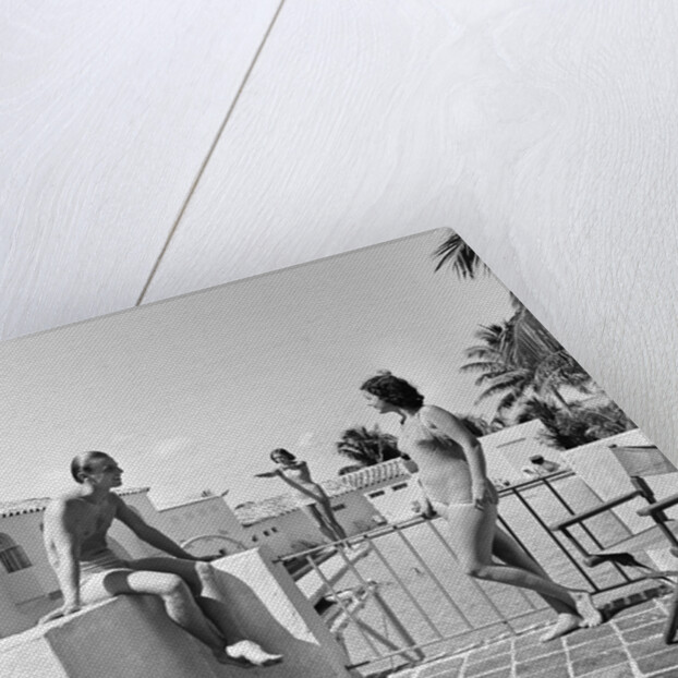 1930s man woman wearing bathing suits on terrace overlooking swimming pool woman on diving board by Anonymous