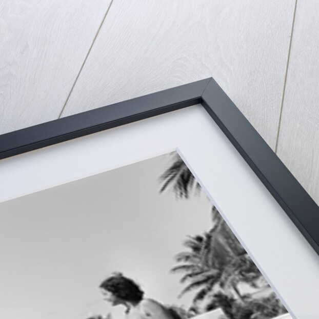 1930s man woman wearing bathing suits on terrace overlooking swimming pool woman on diving board by Anonymous