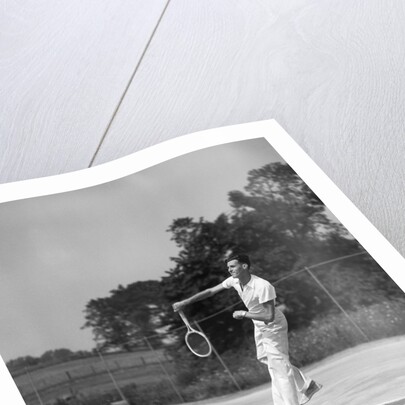 1930s man playing tennis jumping mid air action by Anonymous