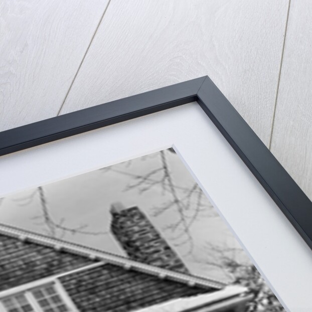 1940s three story shingle style house with pine trees and shrubs covered with snow by Anonymous