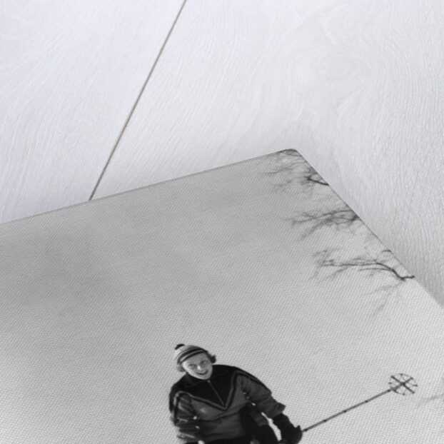 1930s woman holding ski poles skiing in snow by Anonymous