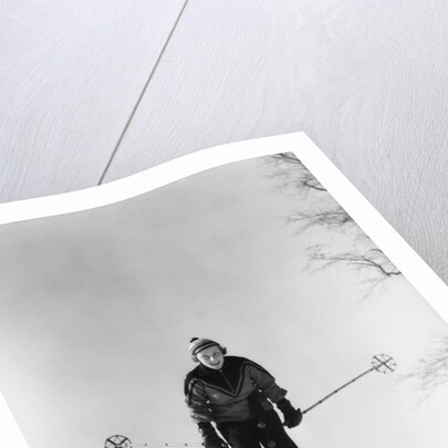 1930s woman holding ski poles skiing in snow by Anonymous