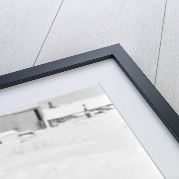 1950s boy on sled in snow looking at camera by Anonymous