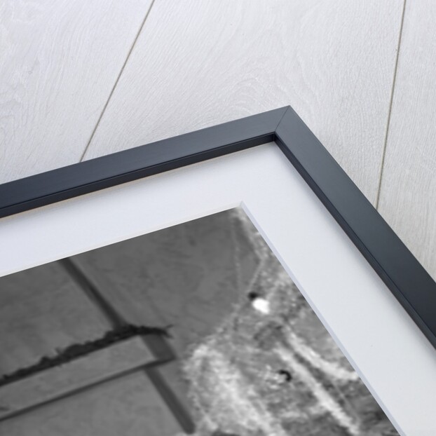 1950s little boy playing toy drum by christmas tree and fireplace looking at camera by Anonymous