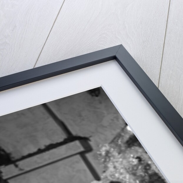 1950s smiling little girl christmas tree talking on toy telephone by Anonymous