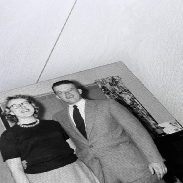 Young newlyweds smile for a portrait, ca. 1956. by Anonymous