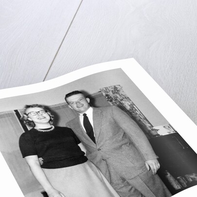 Young newlyweds smile for a portrait, ca. 1956. by Anonymous