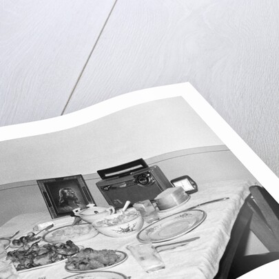 Jesus watches over the dinner table, ca. 1956. by Anonymous