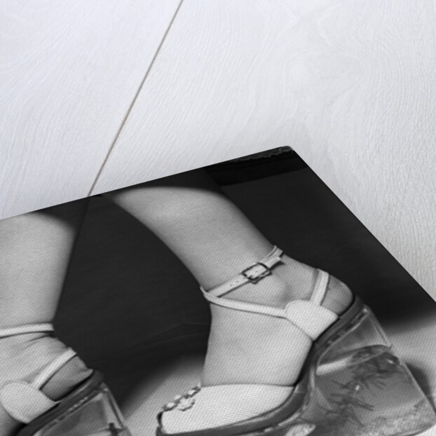 Woman wearing aquarium wedged shoes by Anonymous