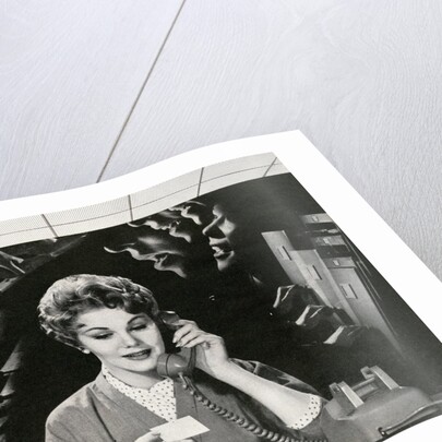 Woman Office Worker on the Phone Distracted by Noise. by Corbis