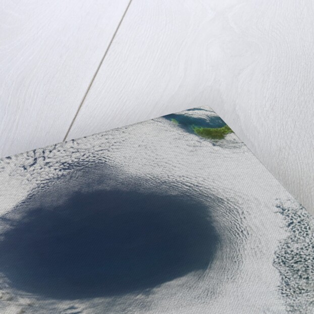 Cloud hole caused by intense high pressure system by Anonymous