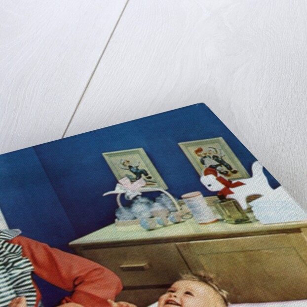 1940s Mother with Her Baby on a Changing Table in a Nursery. by Anonymous
