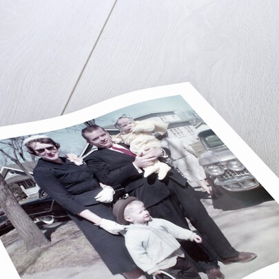 Young family dressed in the Sunday best, ca. 1960. by Anonymous