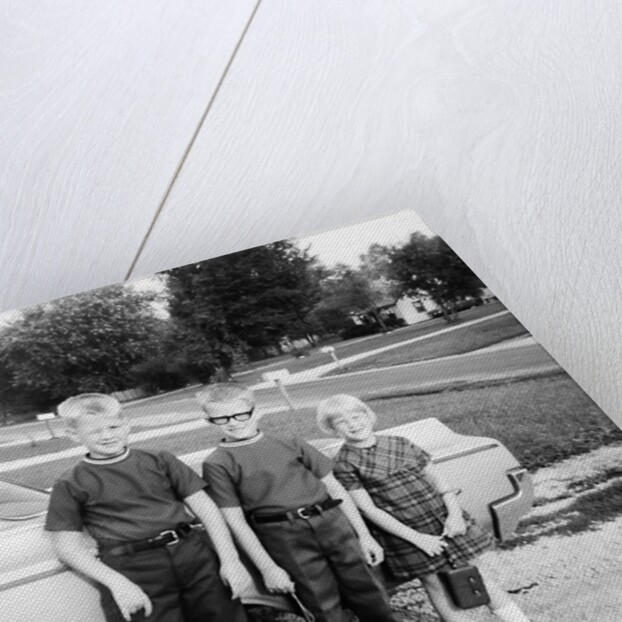 A lineup of kids by the family car. 1965. by Anonymous