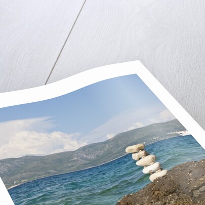 Stack of pebbles on cliff, Lumbarda, Korcula island, Croatia by Anonymous