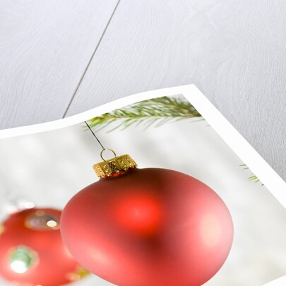 Close-up of hanging red and blue Christmas baubles by Anonymous