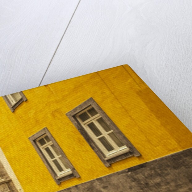 A street in Tavira leading to the entrance of a church by Anonymous