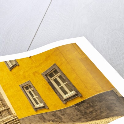 A street in Tavira leading to the entrance of a church by Anonymous