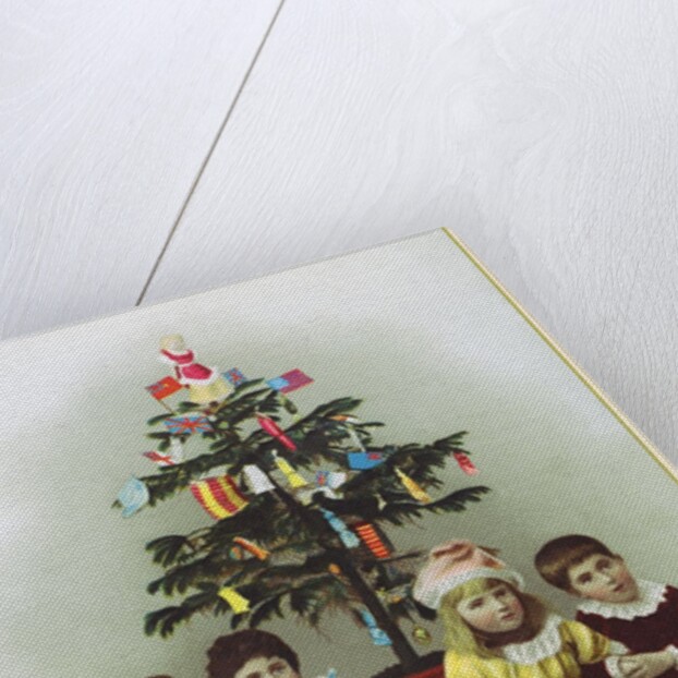 Four children sitting in front of Christmas Tree by Anonymous