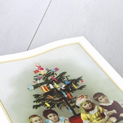 Four children sitting in front of Christmas Tree by Anonymous