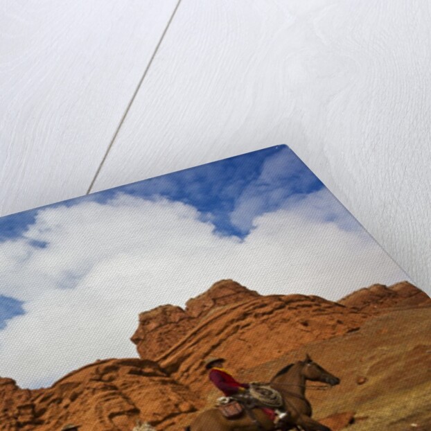 Riders passing under the Red Rock Hills of the Big Horn Mountains by Anonymous