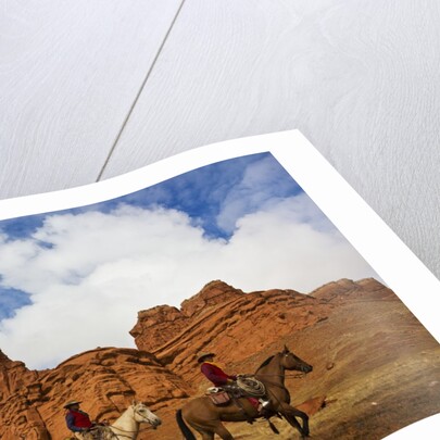 Riders passing under the Red Rock Hills of the Big Horn Mountains by Anonymous