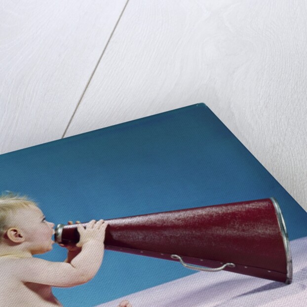1960s Profile Of Seated Baby Shouting Yelling Speaking Into Big Megaphone by Anonymous