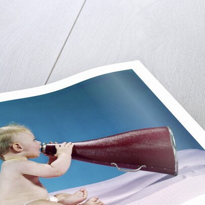 1960s Profile Of Seated Baby Shouting Yelling Speaking Into Big Megaphone by Anonymous